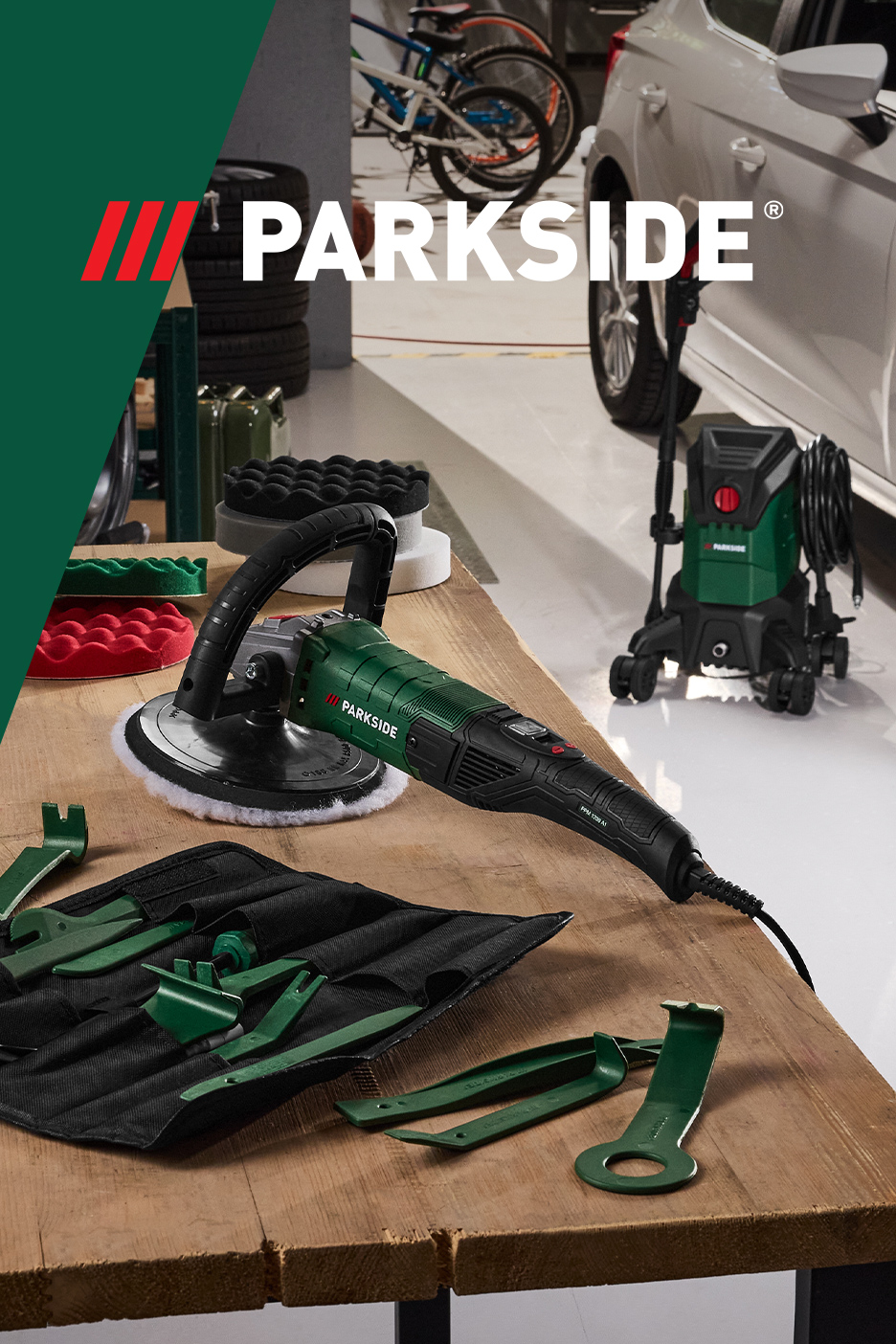 Polirka za automobile, perač pod visokim pritiskom i alati za uklanjanje obloga na drvenom stolu.